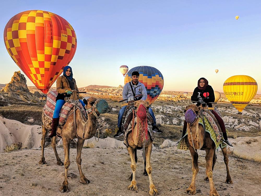 Camel Ride Through Red Valley
